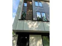Modern exterior showcasing a combination of brick, siding, and large windows, offering a contemporary look at 2424 Memorial Drive Se Dr # 7, Atlanta, GA 30317