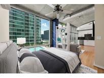 Bright bedroom with stunning city views and sleek modern finishes at 923 Peachtree Ne St # 932, Atlanta, GA 30309