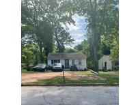Charming single-story home with a simple front yard and ample parking space at 1762 Hadlock Street Southwest, Atlanta, GA 30311