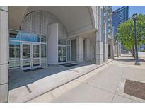 Modern building entrance featuring glass doors, concrete columns, and clear signage for easy access at 361 17Th St # 1121, Atlanta, GA 30363