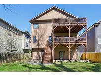 Spacious backyard with a large wooden deck perfect for outdoor entertaining at 2108 Main Nw St, Atlanta, GA 30318
