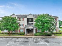 Apartment complex features an attractive exterior with well-maintained landscaping and ample parking space at 12303 Waldrop Pl, Decatur, GA 30034