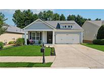Charming single-Gathering home featuring a well-manicured lawn, a two-car garage, and welcoming front porch at 507 Bonneset Ct, Canton, GA 30114