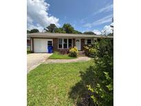 Charming single-story brick home with an inviting front yard and an attached garage at 1098 Laurel Nw Ln, Conyers, GA 30012