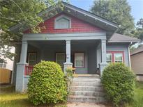 Charming two-story home with a landscaped yard and inviting front porch at 1373 Lucile Sw Ave, Atlanta, GA 30310