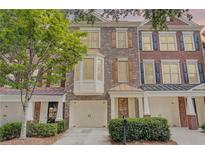 Beautiful brick townhome with attached garage and mature landscaping at 1160 Newpark View Pl # 8, Mableton, GA 30126