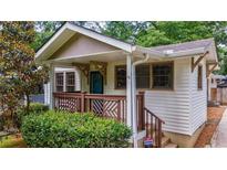Charming front porch with decorative railing, inviting entrance to this lovely home at 91 Rogers Se St, Atlanta, GA 30317