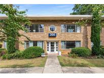 Charming stone building with a beautiful front entrance and well-maintained landscaping at 2240 Cheshire Bridge Ne Rd # 206, Atlanta, GA 30324
