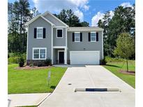 Charming two-story home with a well-manicured lawn and a two car garage at 34 Sonoma Drive, Dallas, GA 30157
