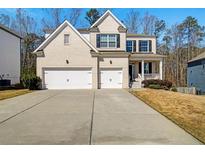 Charming two-story home with a brick facade, two-car garage, and inviting front porch at 2536 Dayview Ln, Atlanta, GA 30331