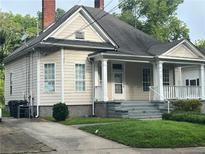 Charming single-Gathering home with covered front porch, mature trees and landscaping at 3155 E East Point E St, East Point, GA 30344