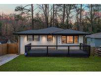 Charming renovated home featuring a deck, updated paint and new landscaping at 1566 Ezra Church Nw Dr, Atlanta, GA 30314
