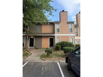 Inviting townhome exterior with charming landscaping and convenient parking at 2340 Beaver Ruin Rd # Un37, Norcross, GA 30071