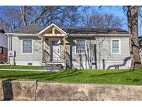 Charming home with updated siding, manicured lawn, and welcoming front porch, offering great curb appeal at 749 Bonnie Brae Sw Ave, Atlanta, GA 30310