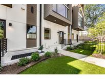 Modern home's inviting facade features manicured lawn, walkway, and stylish exterior design with plenty of greenery at 1099 North Ne Ave # 11, Atlanta, GA 30307