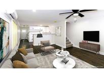 Bright living room featuring an open floor plan, sleek furnishings, and hardwood floors, creating a welcoming atmosphere at 2027 Lois Pl, Atlanta, GA 30318