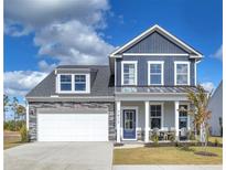 Charming two-story home with stone accents, a two-car garage, and a well-manicured lawn at 522 Regency Trl, Acworth, GA 30102