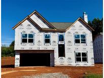 Exterior view of a two-story home under construction, showcasing the facade and architectural design at 500 Charleston Pl, Villa Rica, GA 30180