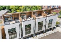 Aerial view of modern townhomes with rooftop patios featuring outdoor furniture and sleek design elements at 1641 Overlook Nw Way # 7, Atlanta, GA 30318