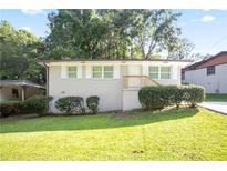 Charming, freshly painted one-story home with well-maintained lawn and mature landscaping at 3436 Adkins Nw Rd, Atlanta, GA 30331