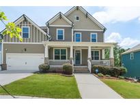 Charming two-story home with a welcoming front porch and well-manicured lawn at 1618 Chancery Ln, Lithia Springs, GA 30122
