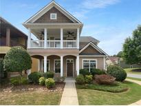 Charming two-story home featuring a welcoming front porch and well-maintained landscaping at 324 Stoney Hollow Rd, Canton, GA 30114