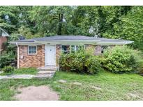 Traditional brick home with a front door and mature landscaping at 1279 Kenilworth Sw Dr, Atlanta, GA 30310
