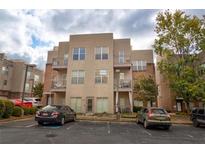 Modern condo building featuring balconies and reserved parking spaces for residents at 238 Walker Sw St # 32, Atlanta, GA 30313