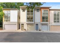 Contemporary townhome exterior featuring a private garage and modern architectural details at 1346 Peter Haughton Nw Way # 2, Atlanta, GA 30318