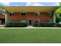 Charming brick apartment building with well-manicured lawn and garden at 1822 N Rock Springs Ne Rd # 24, Atlanta, GA 30324