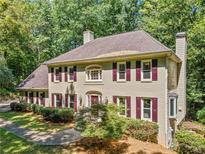 Stunning two-story home with a beautiful landscaped front yard and charming brick facade at 4754 Township Chase, Marietta, GA 30066