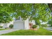 Charming two-story home with a well-maintained lawn and attached two-car garage at 3451 Carriage Chase Rd, Atlanta, GA 30349