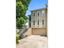 Charming home with a two-car garage and appealing architectural details at 2556 Oakwood Se Trce, Smyrna, GA 30080