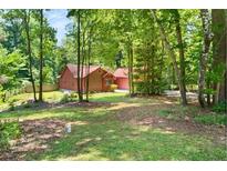 Charming single-Gathering home with mature trees creating a private, secluded yard at 2945 Cardinal Lake Cir, Duluth, GA 30096