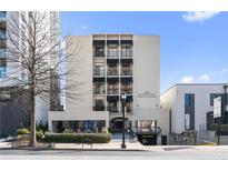 Modern condominium building with black awnings located at 1421 Peachtree Street at 1421 Peachtree Ne St # 310, Atlanta, GA 30309