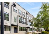 Modern townhome featuring a neutral color palette, large windows, and private entryways at 1265 Wright Se Ln, Atlanta, GA 30316