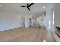Bright and airy living room featuring hardwood floors, recessed lighting, and an open floor plan with kitchen view at 1919 Deco Dr, Kennesaw, GA 30144