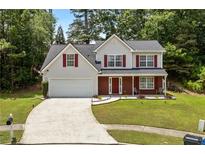 Charming two-story home with a well-manicured lawn and inviting curb appeal at 3601 Stephens Creek Pl, Loganville, GA 30052