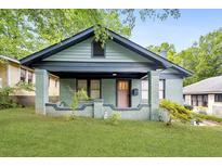 Charming home featuring a covered porch, brick facade, and well-maintained front yard at 531 Atlanta Se Ave, Atlanta, GA 30315