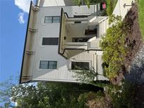 Charming two-story home with covered porch and classic white siding at 410 Anglin Walk, Alpharetta, GA 30009