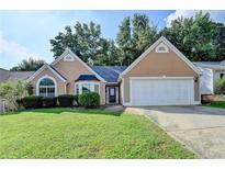 Charming home with a well-manicured lawn and two-car garage at 3625 Ennfield Lane Ln, Duluth, GA 30096