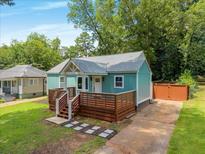 Charming home featuring a stylish deck, a well-maintained lawn, and a cozy, inviting exterior at 2197 Jernigan Dr, Atlanta, GA 30315