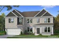 Charming two-story home with light brick, dark gray accents and a well-manicured lawn at 2517 Cadenza Cir, Dacula, GA 30019