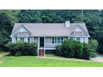 Charming single-story home with a welcoming front porch and a well-maintained landscaped yard at 101 Tide Water Way, Rockmart, GA 30153
