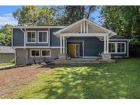 Charming two-story home with a welcoming front porch, blue siding, and well-maintained lawn at 1621 Northlake Springs Ct, Decatur, GA 30033