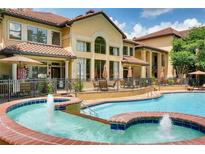 Resort-style pool featuring lounge chairs, umbrellas, and fountain features offer a relaxing atmosphere at 3777 Peachtree Ne Rd # 1326, Atlanta, GA 30319