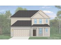 Charming two-story home featuring light brick paneling, neutral siding, and an attached two-car garage at 2565 Dixon Pl, Lawrenceville, GA 30045