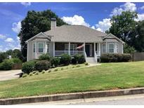 Charming single-Gathering home with a well-maintained lawn and welcoming front porch at 493 Kyles Cir, Hiram, GA 30141