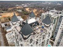 Luxury condo aerial view showcasing rooftop terraces and panoramic city views at 199 14Th Street Ne St # 704, Atlanta, GA 30309