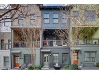 Charming townhome with colorful exterior, private balconies, and inviting curb appeal at 768 Aerial Way, Atlanta, GA 30312
